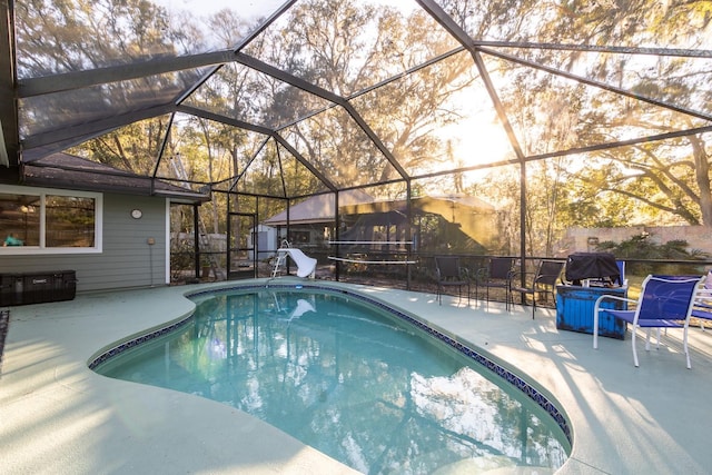 view of pool featuring a water slide, a patio area, a lanai, and a fenced in pool