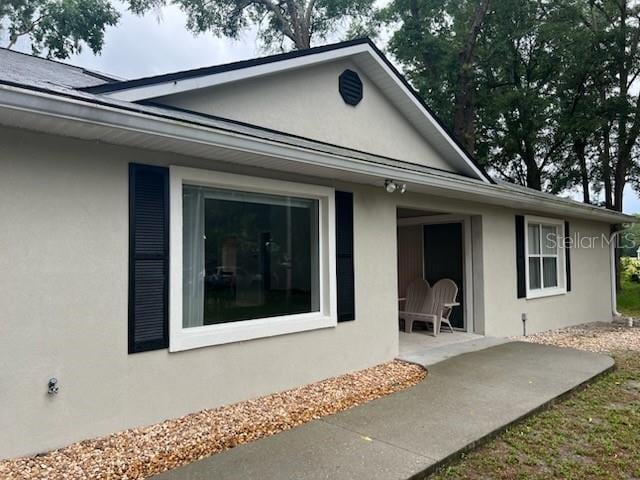 exterior space featuring a patio and stucco siding