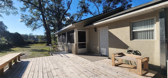 deck with a sunroom