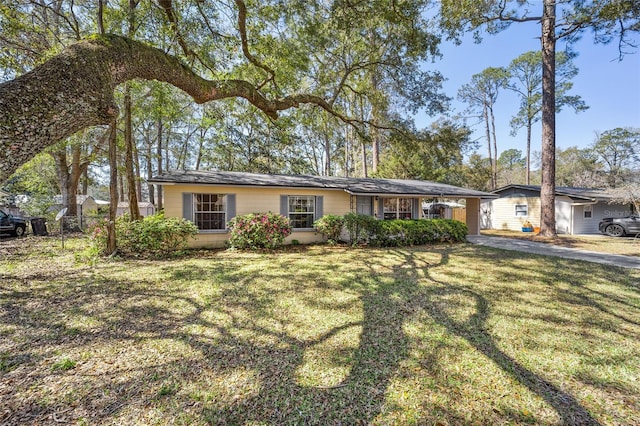 ranch-style house with a front lawn