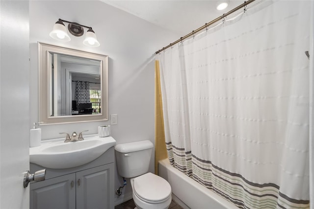 bathroom featuring shower / bath combo with shower curtain, vanity, and toilet