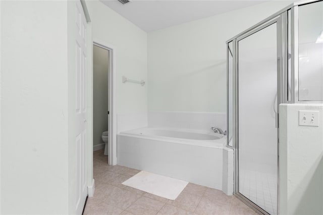 full bath featuring a garden tub, visible vents, toilet, a stall shower, and tile patterned flooring