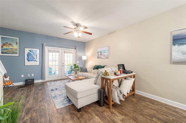 living area with a ceiling fan, french doors, baseboards, and wood finished floors