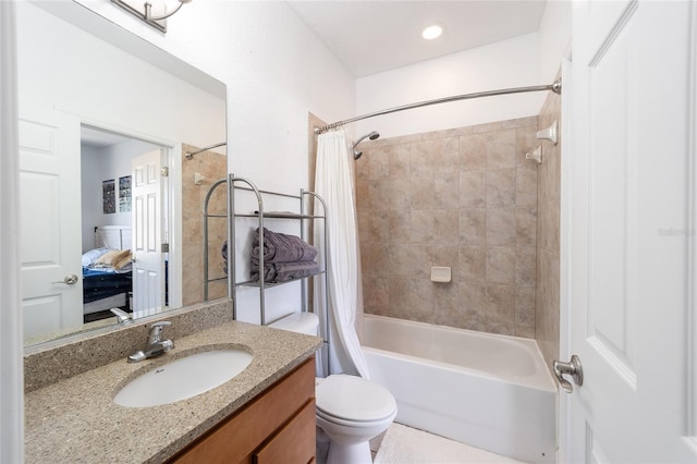 full bath with shower / tub combo with curtain, vanity, toilet, and ensuite bath