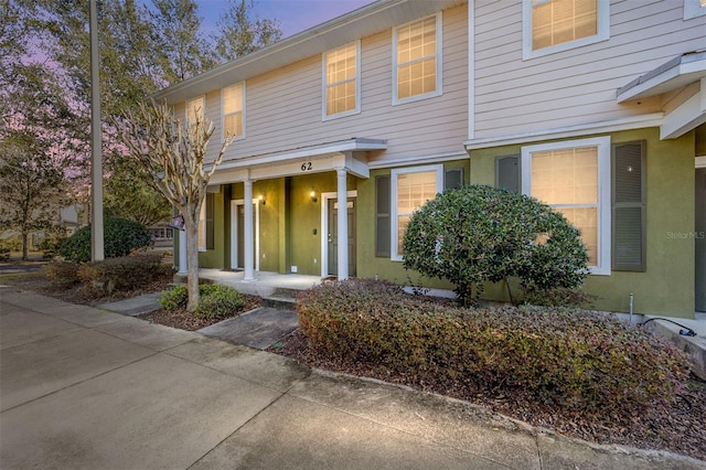 view of property featuring stucco siding