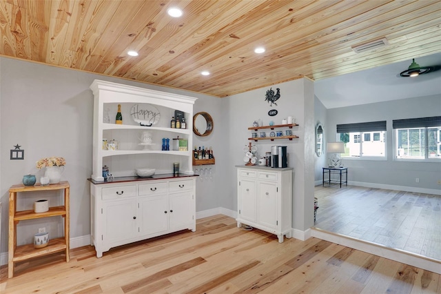 kitchen with light wood-type flooring, wood ceiling, white cabinetry, and open shelves