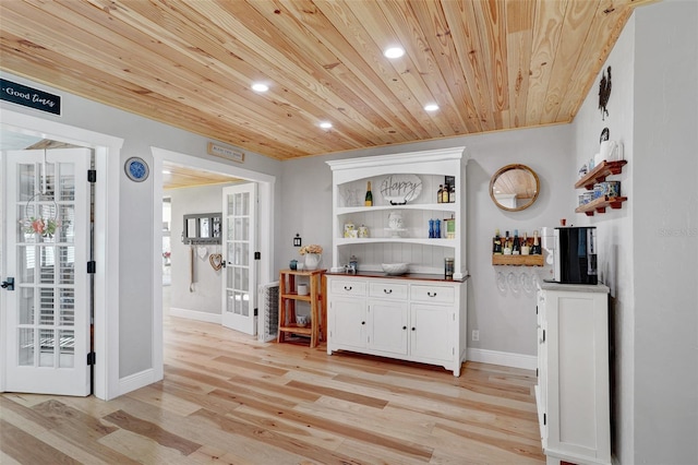 bar featuring french doors, recessed lighting, light wood-style floors, wooden ceiling, and baseboards