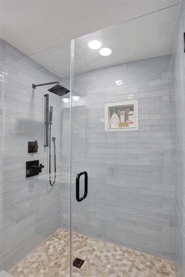 bathroom with a shower stall