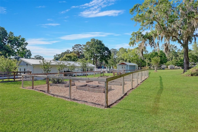 view of yard with a garden and fence