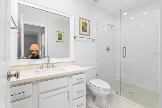 full bathroom featuring vanity, toilet, a stall shower, and marble finish floor