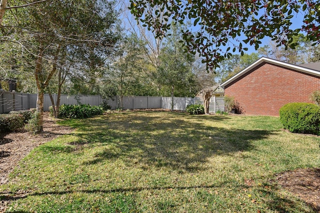 view of yard featuring a fenced backyard