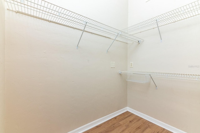 spacious closet with light wood-style floors