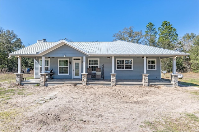 view of front of property with a porch, metal roof, and ceiling fan