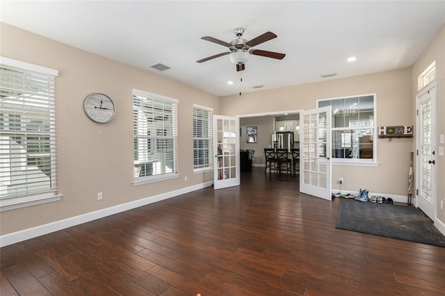 interior space featuring french doors, dark wood-type flooring, visible vents, and baseboards