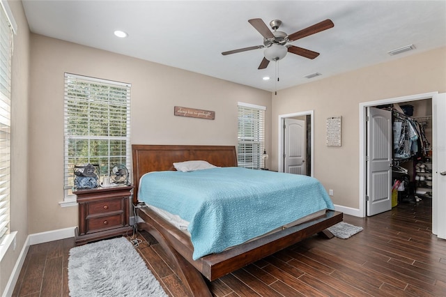 bedroom with dark wood-type flooring, visible vents, and baseboards