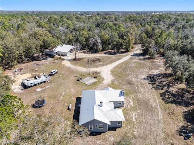 drone / aerial view with a view of trees