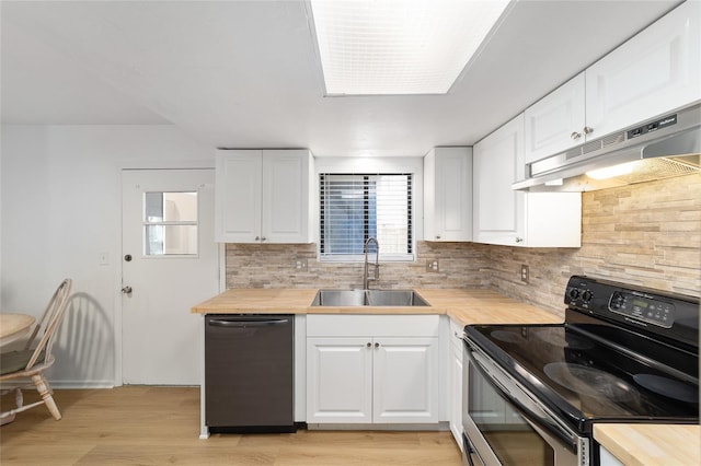 kitchen featuring butcher block counters, dishwasher, under cabinet range hood, and electric range oven