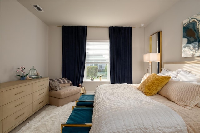 bedroom featuring light carpet and visible vents