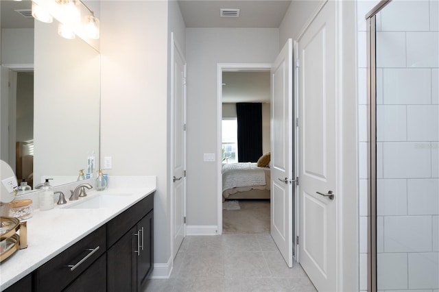 bathroom featuring visible vents, connected bathroom, a shower stall, vanity, and tile patterned flooring