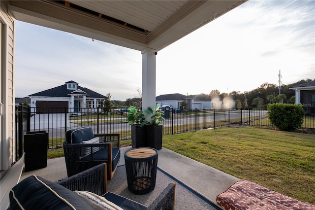 view of patio / terrace with a residential view, fence, and an outdoor living space