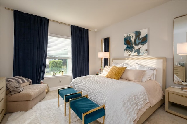 carpeted bedroom with baseboards