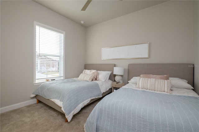 bedroom featuring carpet flooring, a ceiling fan, and baseboards