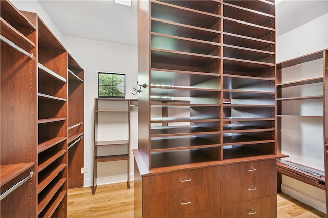 spacious closet featuring light wood-type flooring