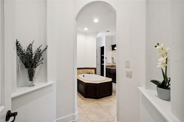 full bath featuring tile patterned floors, recessed lighting, a bath, and vanity