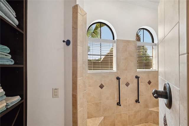 bathroom with a tile shower