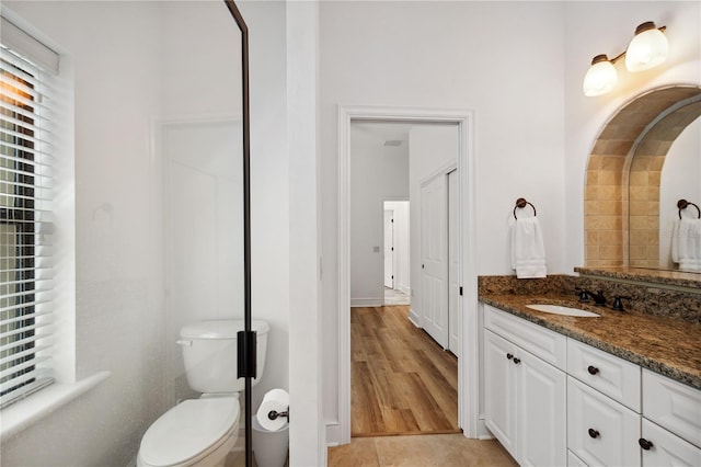 bathroom with vanity, toilet, and tile patterned flooring