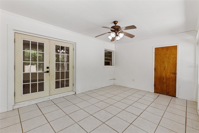 4031 NW 75th St, Gainesville, FL 32606 - spare room featuring baseboards, ceiling fan, ornamental molding, french doors, and light tile patterned floors