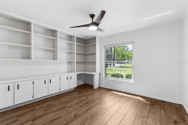 4031 NW 75th St, Gainesville, FL 32606 - unfurnished room featuring baseboards, ceiling fan, and wood finished floors