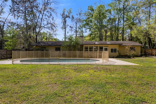 4031 NW 75th St, Gainesville, FL 32606 - view of pool featuring fence, a lawn, a patio area, and a fenced in pool