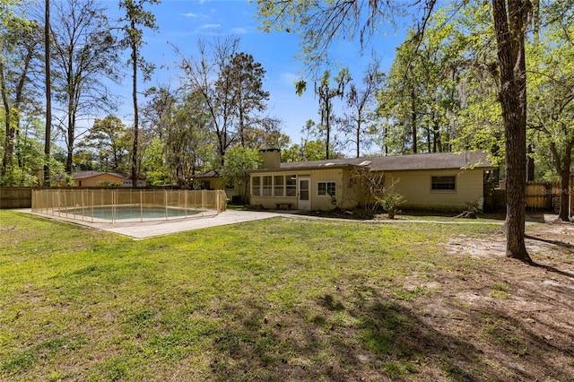 4031 NW 75th St, Gainesville, FL 32606 - view of yard featuring a patio, fence, and a fenced in pool
