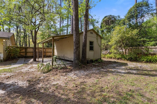 4031 NW 75th St, Gainesville, FL 32606 - exterior space featuring an outdoor structure, a carport, and fence