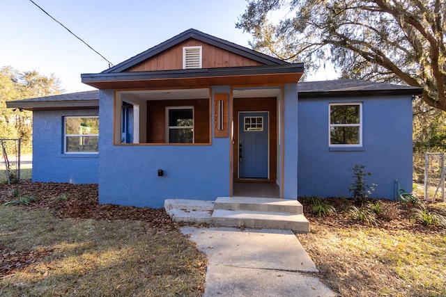 view of front of house with entry steps and stucco siding