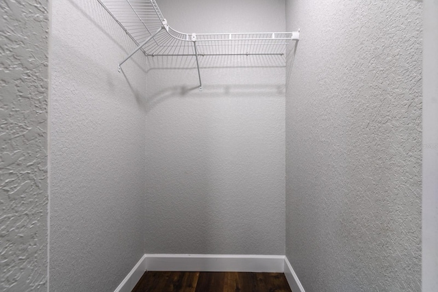 spacious closet with wood finished floors