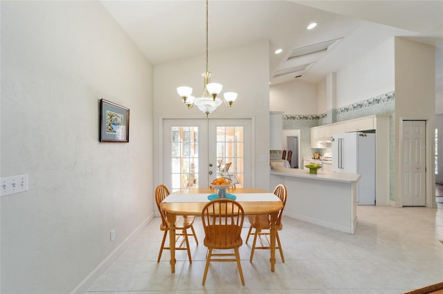 dining space with high vaulted ceiling, french doors, baseboards, and light tile patterned floors