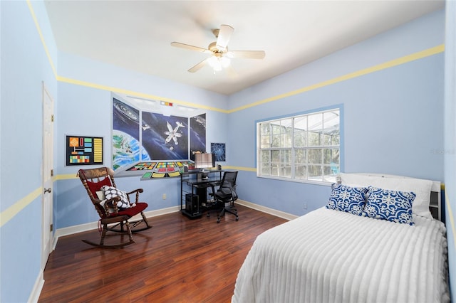 bedroom featuring a ceiling fan, baseboards, and wood finished floors