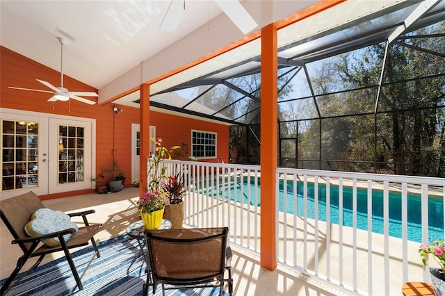 outdoor pool featuring a patio, french doors, a lanai, and a ceiling fan