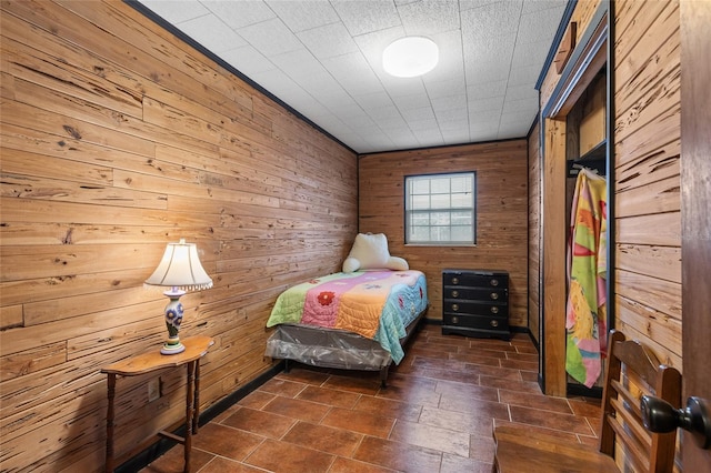 unfurnished bedroom with wood walls