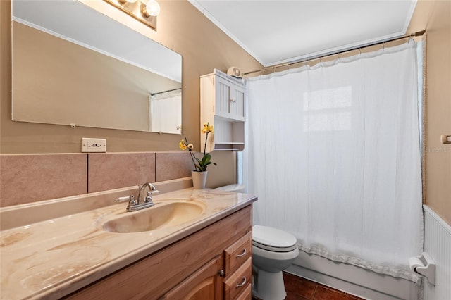 bathroom featuring toilet, crown molding, vanity, and tile patterned floors