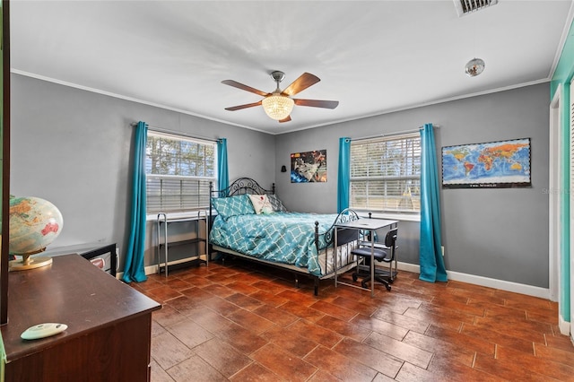 bedroom with a ceiling fan, visible vents, crown molding, and baseboards