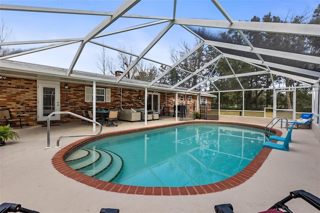 pool featuring an outdoor hangout area, a patio, and a lanai