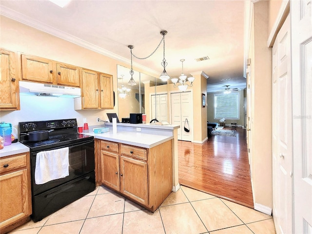 kitchen featuring a peninsula, black range with electric stovetop, light countertops, and under cabinet range hood