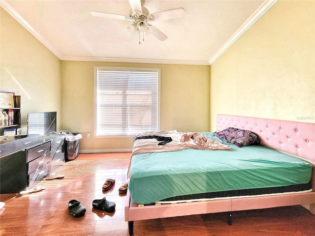 bedroom featuring baseboards, ceiling fan, light wood-style flooring, and crown molding