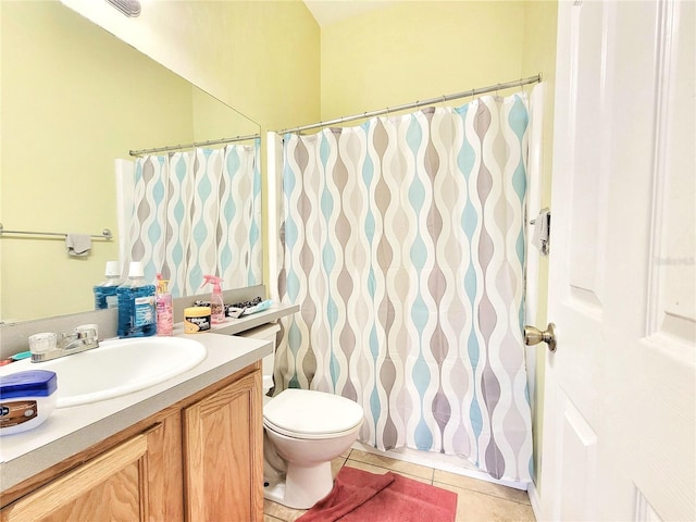 full bathroom featuring a shower with curtain, vanity, toilet, and tile patterned floors