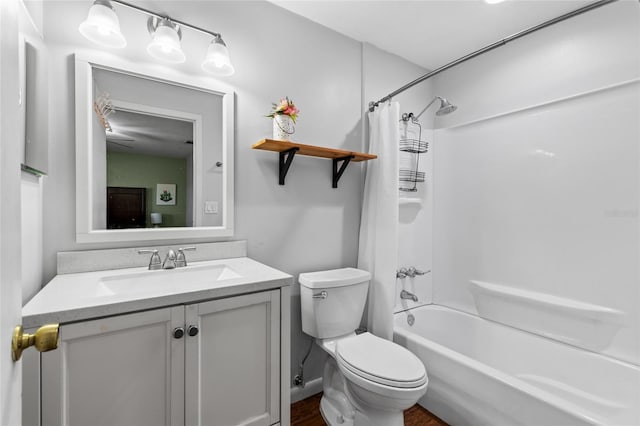 bathroom featuring shower / bath combination with curtain, vanity, and toilet