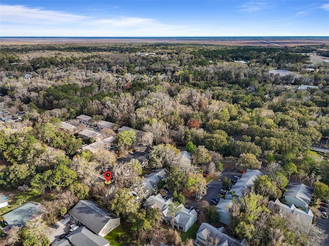 aerial view featuring a wooded view