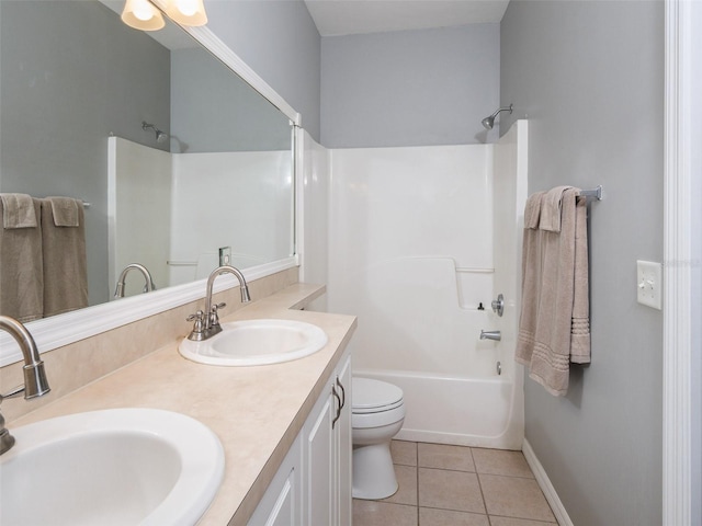 full bathroom featuring double vanity, bathtub / shower combination, a sink, and tile patterned floors